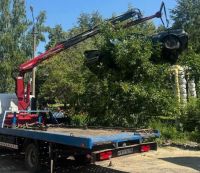 В Арбеково эвакуировали брошенный «Ford», заросший кустами